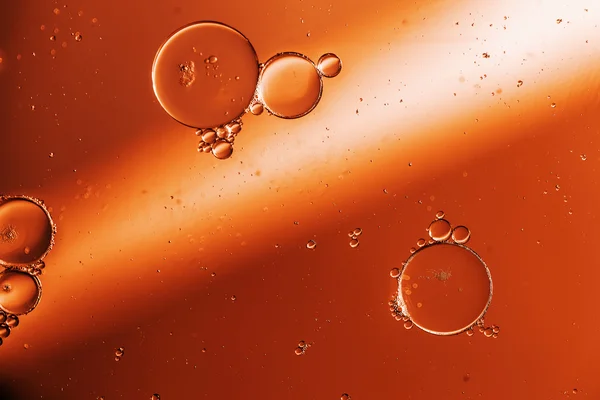 Oil drops on a water surface — Stock Photo, Image