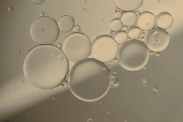 Oil drops on a water surface — Stock Photo, Image