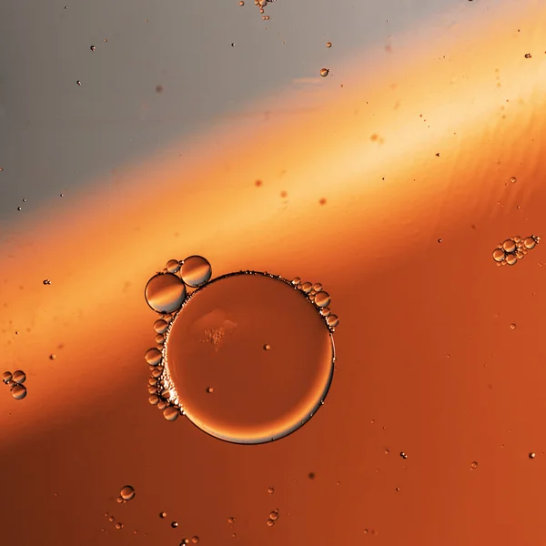 Oil drops on a water surface — Stock Photo, Image