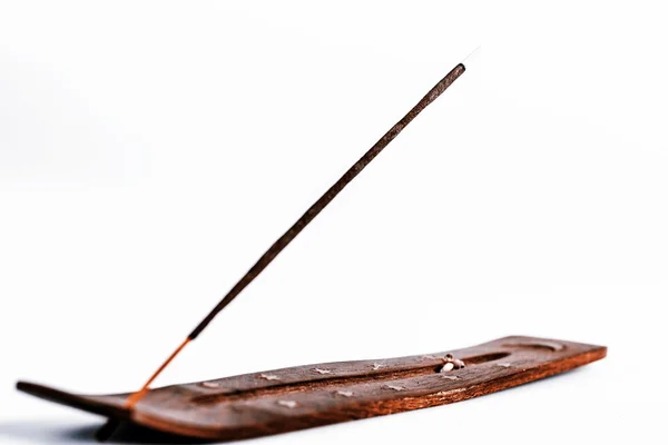 Incense stick on a wooden support on a white background — Stock Photo, Image