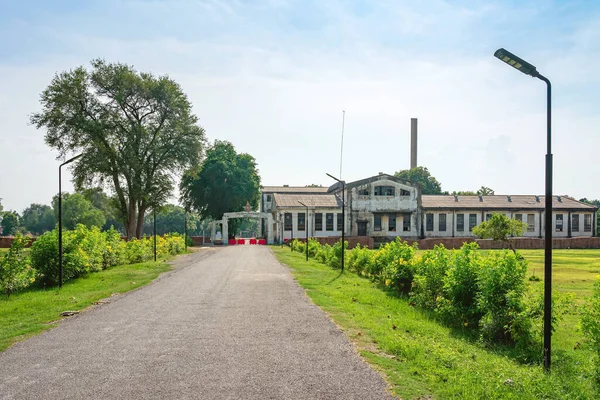 The old paper mill used to produce paper during World War II, transformed into a new public attraction and Thai characters at the entrance translate to English as Thai paper factory Kanchanaburi, 1938