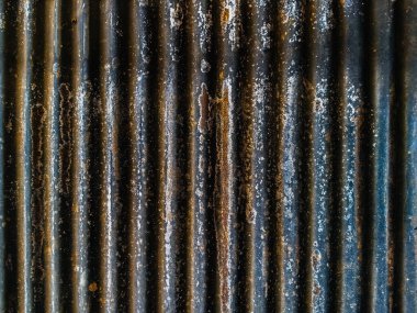 Eski ve paslı çinko çarşaf duvarının artistiği. Klasik stil metal yaprak çatı dokusu. Eski metal levha deseni. Paslı metal ya da yanlamasına. Galvanizasyon aşınması. Geçmiş kavramında arkaplan ve doku