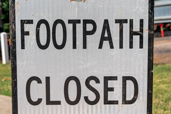 Footpath closed signage while construction repair work is completed