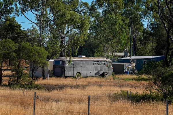 An old bus used as a home by the leasee of a gemfields sapphire mining claim in outback Australia