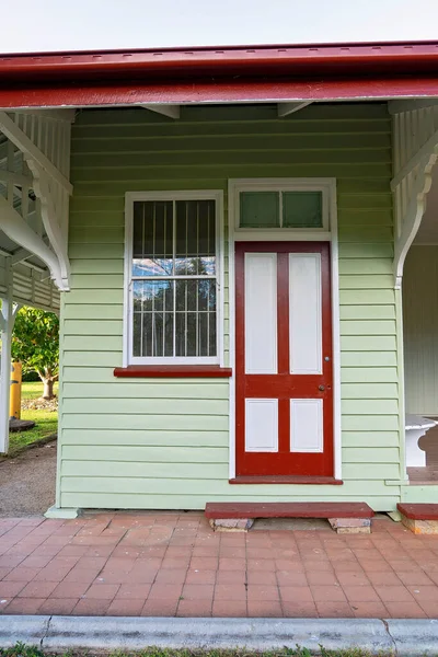 Entry door to an old railway train station converted into a cottage craft shop in a country town, retaining many of the features of a bygone era