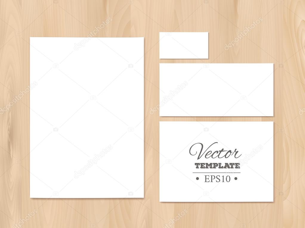 Corporate identity templates on a wooden background. Stationery