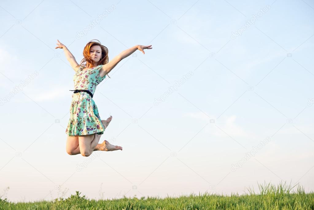 Happy Young Woman Jumping