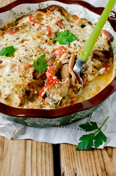 Carp baked with sour cream, pepper, bacon and onions — Stock Photo, Image