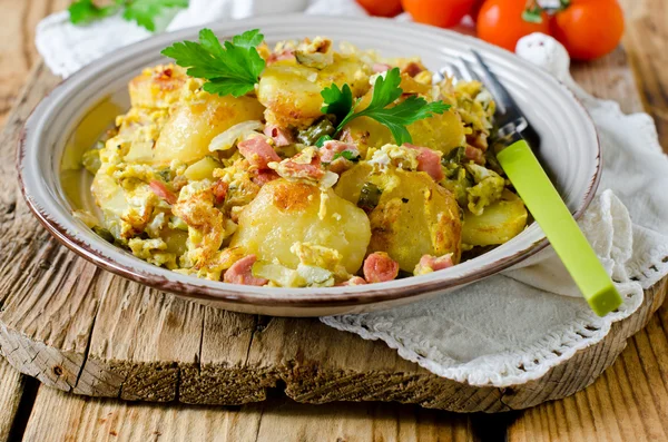 Fried potatoes with ham and pickles — Stock Photo, Image