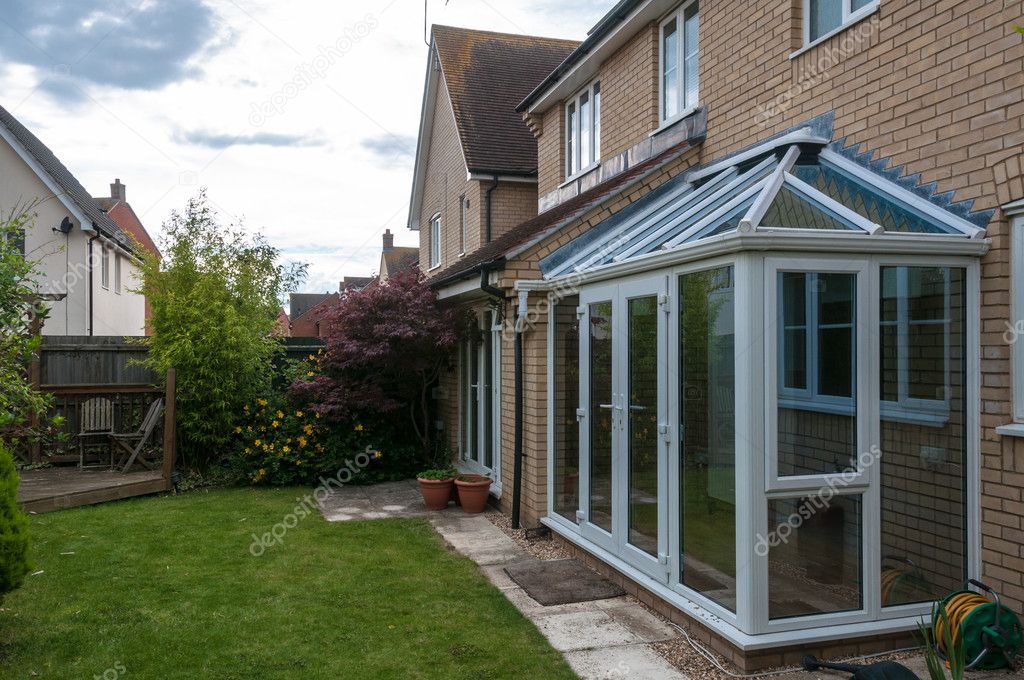 Conservatory (sun room) and view of back graden