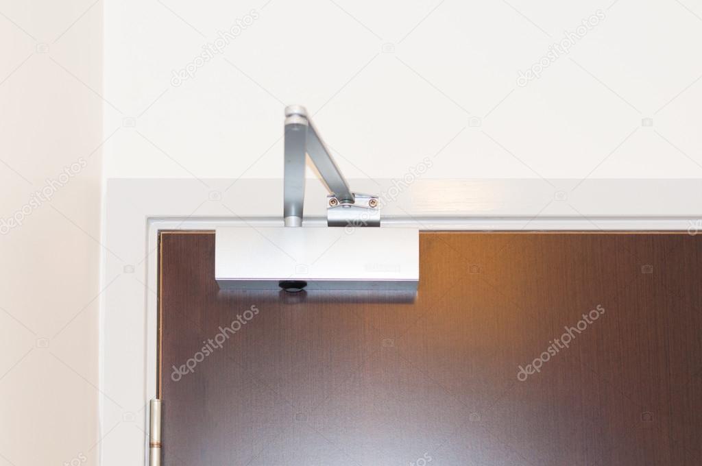 Door closer or Shock absorber close up — Stock Photo © kk_tt 69257465