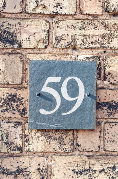 House number fifty nine for use as a background — Stock Photo, Image