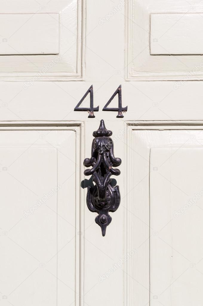 Door number 44 with door knocker close up