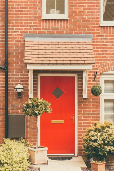 Front door of newly built house — Stock Photo, Image