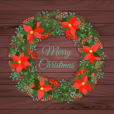 Tahta bir arka planda Noel çelengi