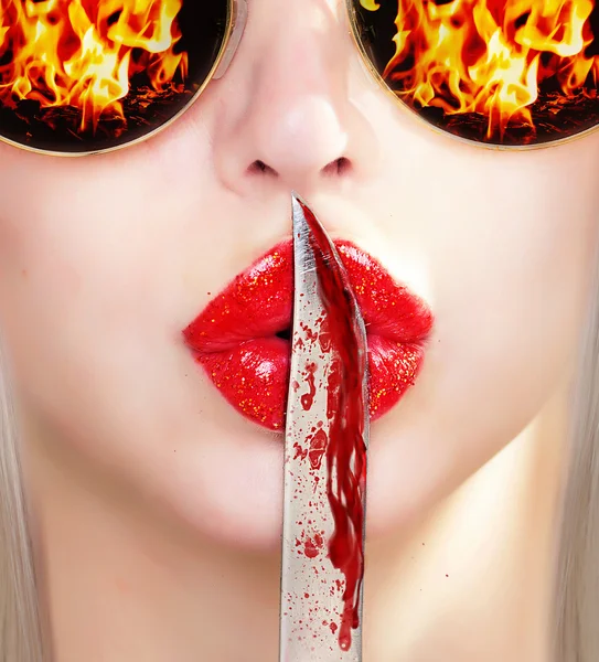 Knife on lips. — Stock Photo, Image