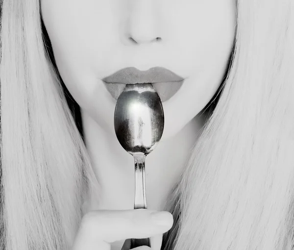 Woman with a spoon  close up — Stock Photo, Image