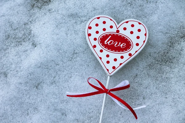 Heart on snow. Concept of cooled feelings — Stock Photo, Image