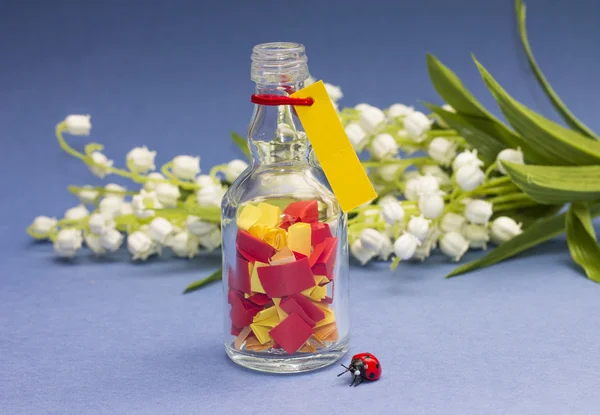 Concepto de sueños. Botella con papeles de colores —  Fotos de Stock