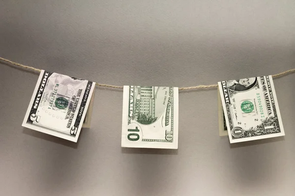 Dollar banknotes drying on rope. Photo concept — Stock Photo, Image