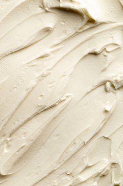 Yiyeceğin ya da kozmetik kremin kremsi dokusunu kapat. Kozmetik ya da gıda dokusunun makro fotoğrafçılığı.