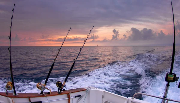 Trolling offshore fisherboat rod reels wake sea Stock Photo by ©lunamarina  5506192