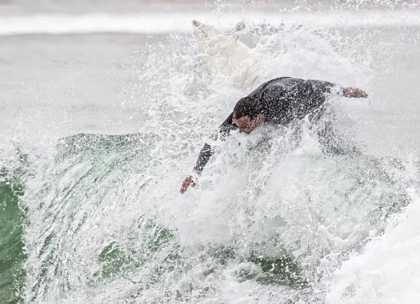 Man surfing a wave in the sea