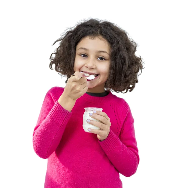 Menina comendo iogurte Fotos De Bancos De Imagens Sem Royalties