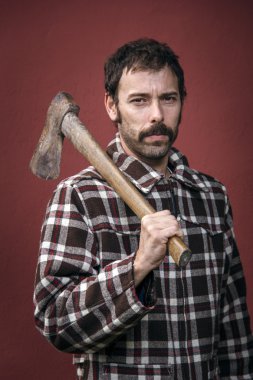Lumberjack with old rusty ax clipart