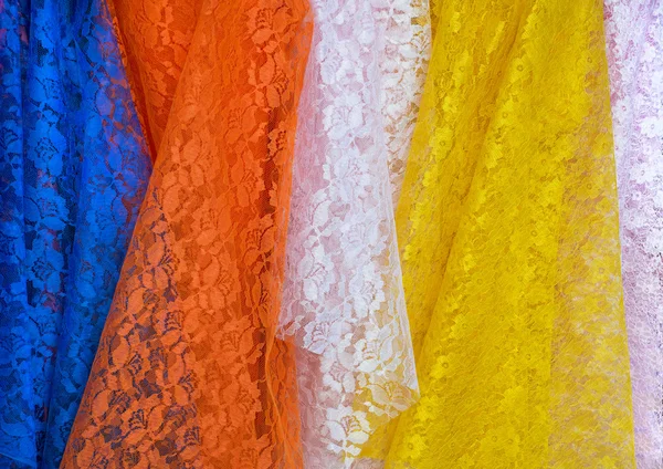 Lace Fabric display in fabric shops,blue,orange,pink and yellow — Stock Photo, Image