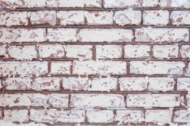 Beyaz eski boyalı tuğla duvar