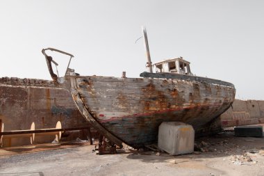 Abandoned old fishing boat. clipart