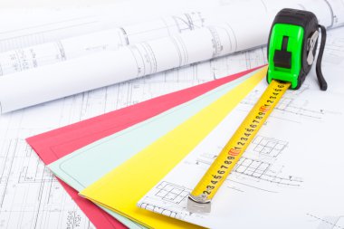 Architectural drawings and tape measure. clipart