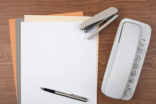 Sheets of paper and office accessories on wooden texture. — Stock Photo, Image