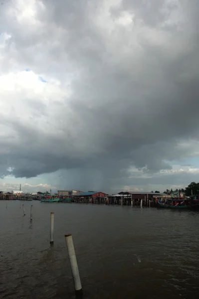 Thunderstorm approaches fishing village harbour — Stock Photo, Image