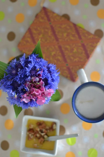 Cup of hot coffee, flowers and book. Romantic background with retro filter effect — Stock Photo, Image