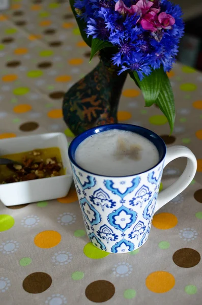 Cup of hot coffee, flowers and book. Romantic background with retro filter effect — Stock Photo, Image