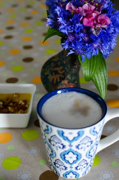 cup of hot coffee, flowers and book. Romantic background with retro filter effect