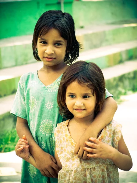 Rural smiling girls sisters closeup morning in sunlight India — Stock Photo, Image