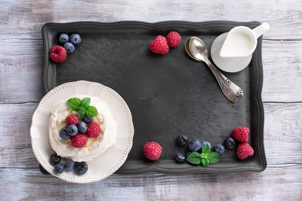 Pavlova cake with fresh summer berries