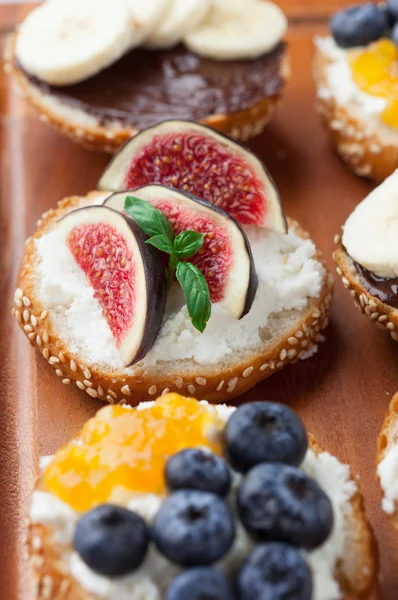 Variety of bagels with different toppings — Stock Photo, Image