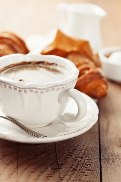 Fresh croissants and cup of coffee — Stock Photo, Image