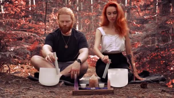 Red Haired Couple Playing White Quartz Crystal Singing Bowls Forest — Wideo stockowe