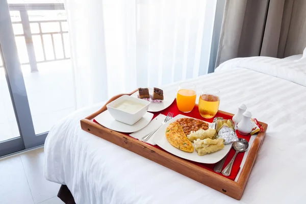 Breakfast in tray on bed
