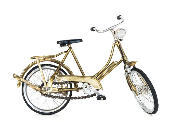 Pequeña bicicleta de juguete de color oro —  Fotos de Stock