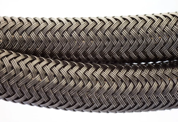 Black woven braided tube housing cable — Stock Photo, Image