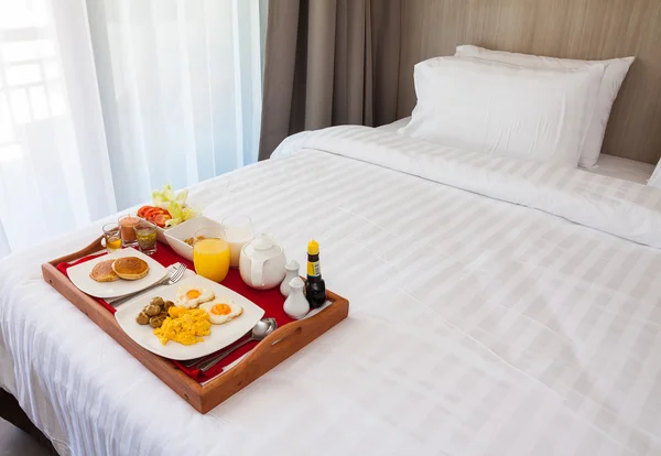 Breakfast in tray on bed — Stock Photo, Image