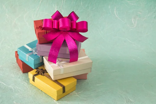 Colorful small gift box with bow