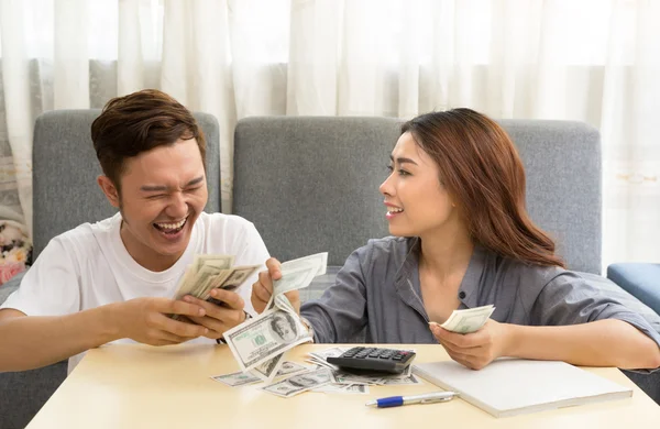 Young asian couple happy with money — Stock Photo, Image