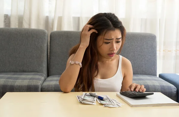 Asian woman crazy with bills — Stock Photo, Image